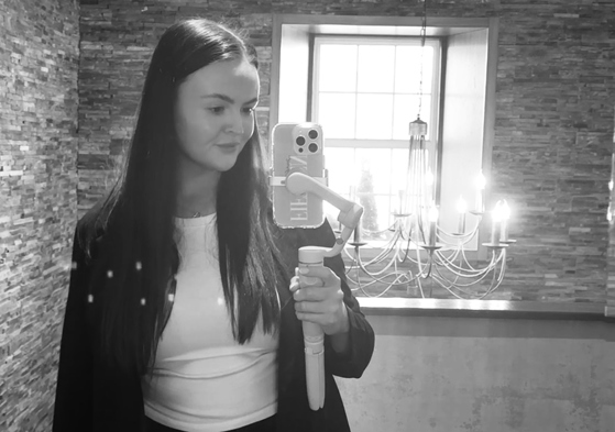 Black and white selfie of Fifteen Weddings & Events owner and wedding content creator Lianna